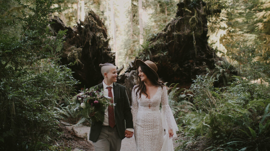 Sydney + Chelsea walk through the redwoods after their elopement. They were told that their elopement inspired others, another good reason to elope that you never would have thought of before.