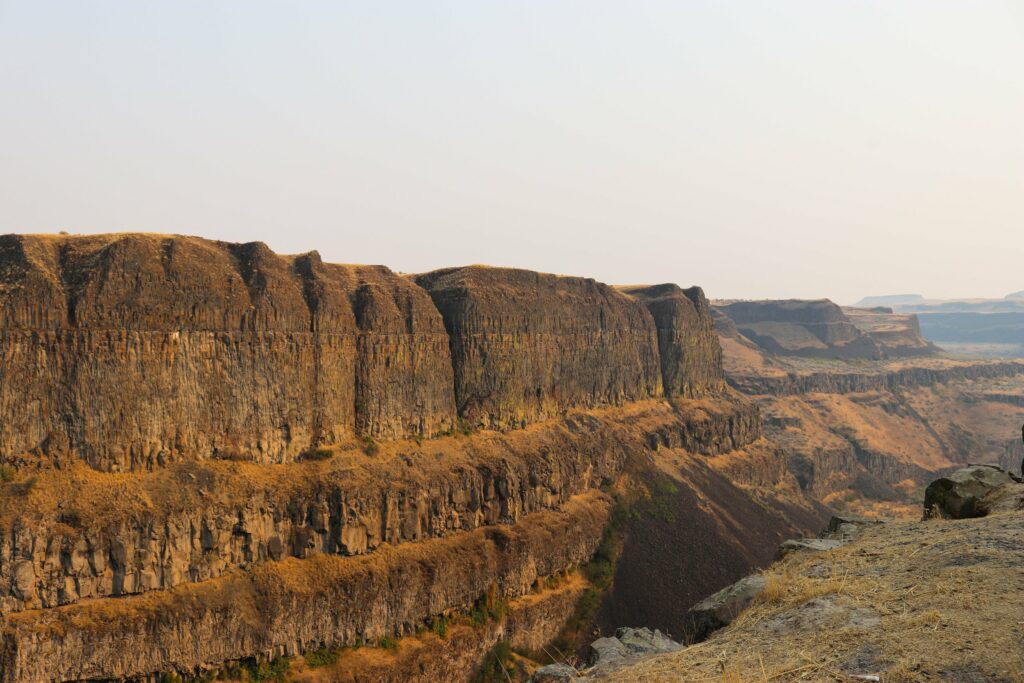 A landscape view of Eastern Washington with rocky orange cliffs.