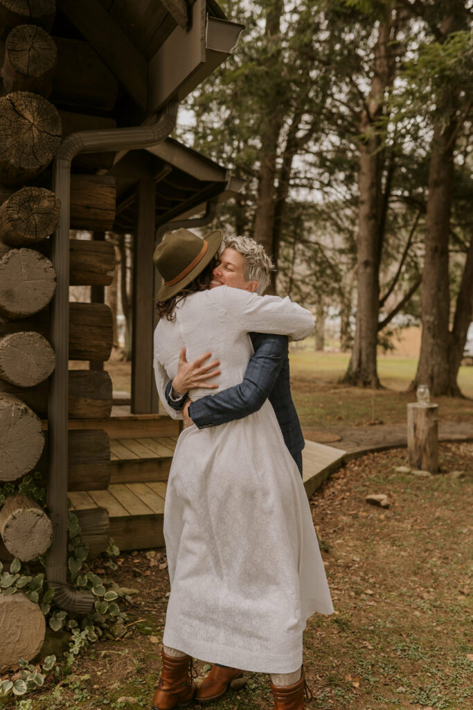 A couple hugs after doing their first look before wedding.