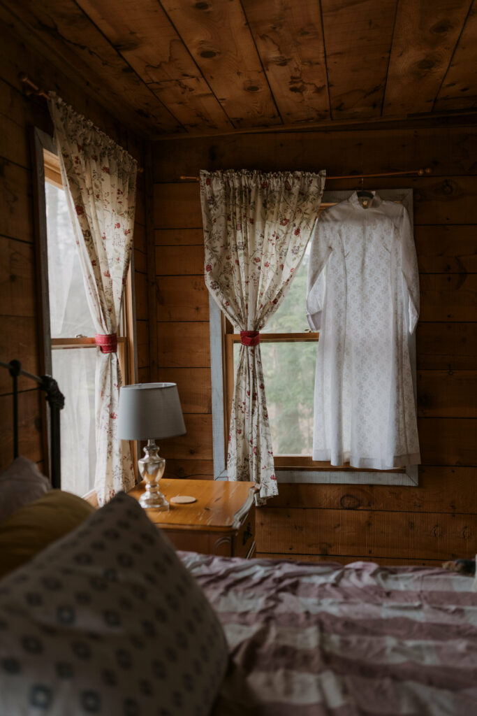 Interior photograph of a lamp on a table inside a cabin in the North Carolina mountains.