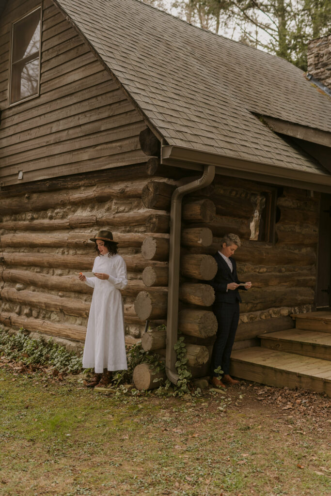 A couple standing on different sides of a cabin reading handwritten love letters to each other before eloping in western North Carolina.